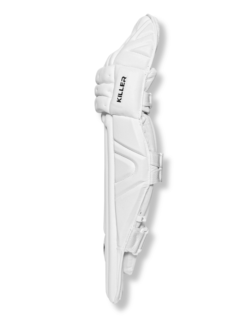 Side profile of a white Killer Edition batting leg guard showing knee roll depth and instep